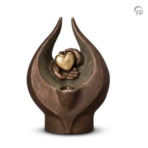 Bronze, flamed shaped handmade urn with hands holding a gold heart